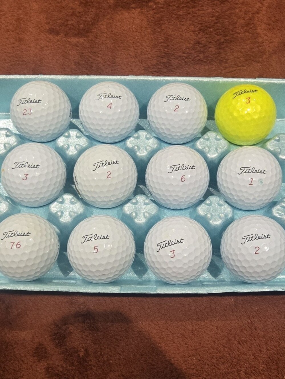 12 Titleist ProV1x Golf Balls. 11 White. 1 Yellow. Pristine Playing Condition.